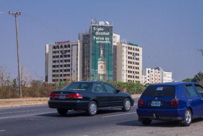 Wall drape @ LABOUR HOUSE, ALONG PRESIDENTIAL AIRPORT ROUTE ABUJA. — Abuja